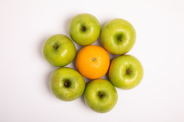 Fruit green apples and a healthy orange