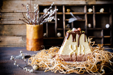 Fototapeta na wymiar Paskha and kulich, Traditional Russian Orthodox Easter Quark Dessert Curd.Easter food background. Traditional cottage cheese cake with candied fruits . Toned image Vintage Style..
