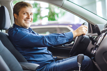 Mature man choosing a new car