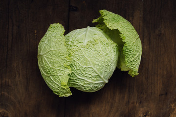 Close up of head of fresh, green savoy cabbage with its crinkled leaves, a healthy winter...
