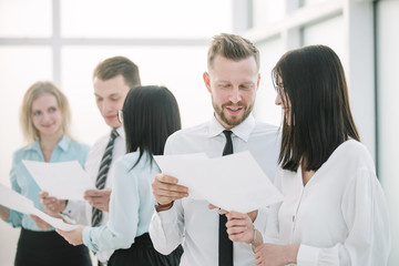 close up. Manager and employees discussing business documents