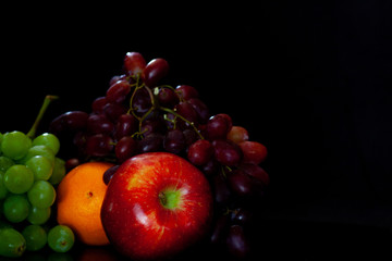 Fresh Fruit on Black Background Room for Copy