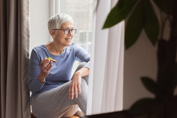 Mature woman having healthy meal