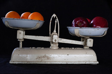 Apples vs Oranges on Black Backround