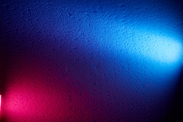Rays of pink and blue lanterns divide the background into two parts