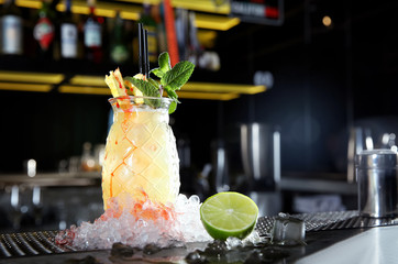 Fresh alcoholic Malibu and pineapple juice cocktail on bar counter. Space for text