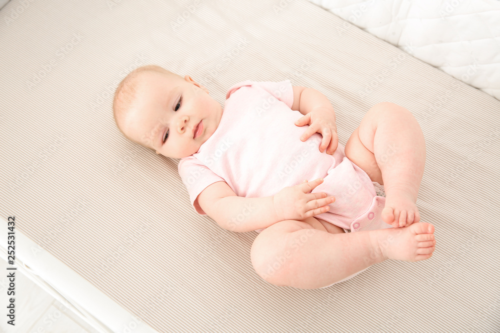 Canvas Prints Cute baby girl in crib. Bedtime schedule