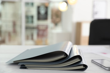 Stack of folders with documents on office table. Space for text