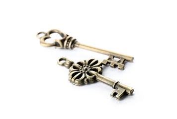 Bronze vintage ornate keys on white background