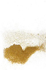 Fototapeta na wymiar Golden glitter on white background, top view