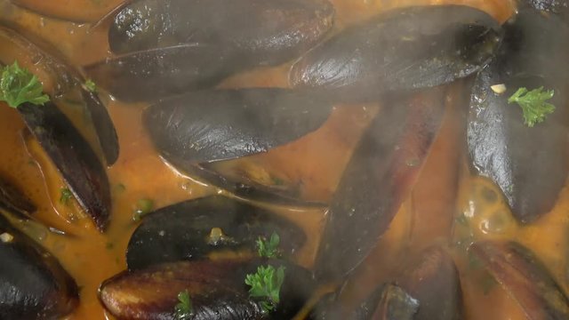 Cooking PEI Mussels In Savory Tomato Garlic Sauce.