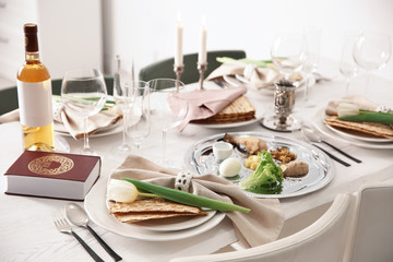 Festive Passover table setting with Torah. Pesach celebration