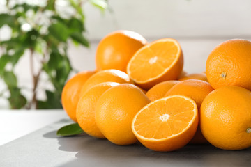 Fresh juicy oranges on table, space for text. Healthy fruits