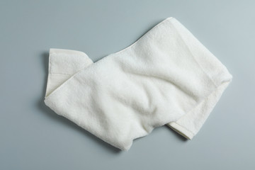 Fototapeta na wymiar Soft towel on light background, top view