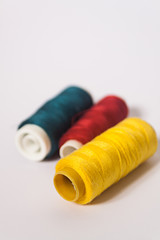 threads lying in red yellow and blue colors