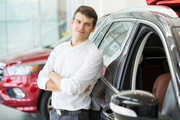 Young man buying a new car