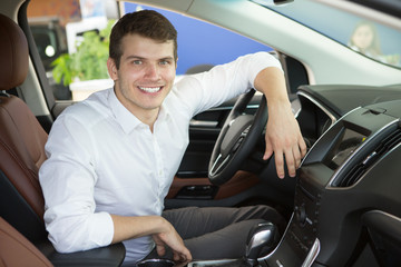 Young man buying a new car