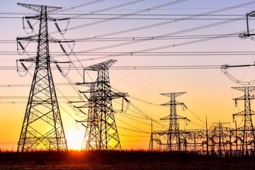 Fototapeta premium The Contour of Transmission Tower in the Background of Sunset