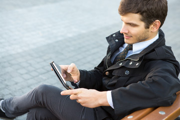 Handsome young businessman outdoors