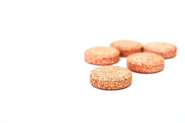 Tablets of vitamin B,C added calcium magnesium and zinc supplement use by dissolve in the water and drink for good health with white background