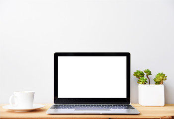 blank screen Modern laptop computer with mouse,Smart phone and Succulent on wood table in office view backgrounds