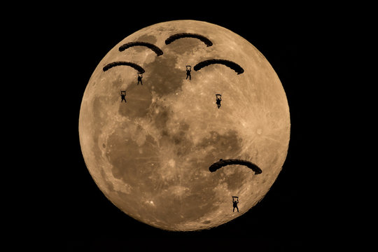 illustration of five parachutes attack team landing in the night scene with big full moon background