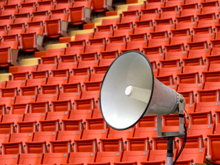 White speaker with stadium seat background