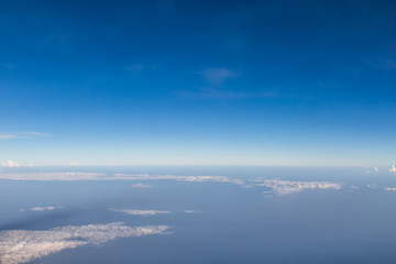 blue sky background with tiny clouds