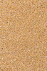 Fototapeta na wymiar Closeup of wet sand texture pattern on the beach