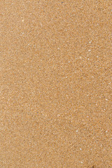 Closeup of wet sand texture pattern on the beach