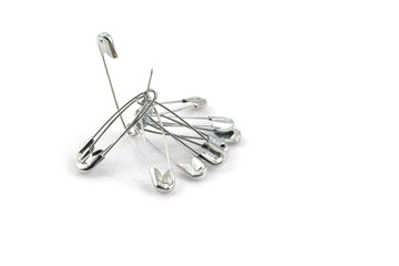 Bunch of safety pins isolated on white