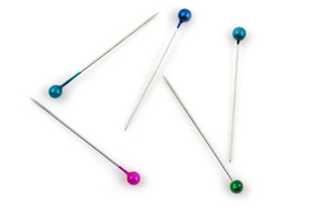 Color sewing push pins isolated on white