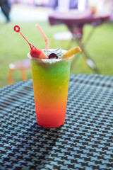 Drink of fresh mix fruit and soda decorate with orange sliced
