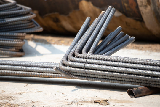 curved reinforcements steel bars in construction site. blended metal bar.