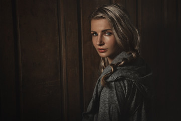 Fototapeta premium Blonde against old wooden