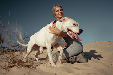 Woman with white Dogo Argentino
