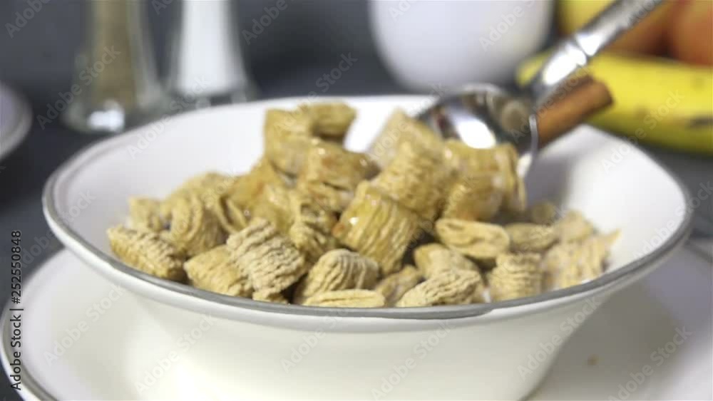 Poster taking a spoonful of oat breakfast cereal