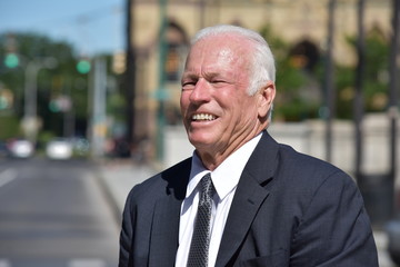 Smiling Senior Business Man Downtown