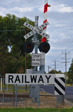 Railway crossing sign on street