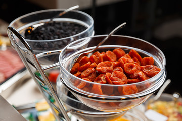 dried apricot in glass bowl