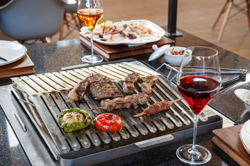 meat with vegetables on grill