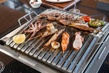 seafood and meat on grill