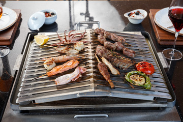 seafood and meat on grill