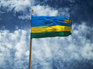 Rwanda flag Silk waving flag of Rwanda made transparent fabric with wooden flagpole gold spear on background sunny blue sky white smoke clouds real retro photo Countries of world 3d illustration