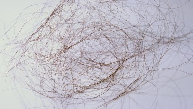 Hair falling into floor, Hair loss concept