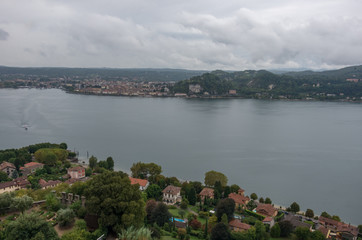 Fototapeta na wymiar Town of Arona on Maggiore Lake, Piedmont, Italy. View from Rocca di Angera