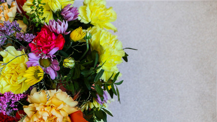 Bright colored spring bouquet on  light background, with  place for text.