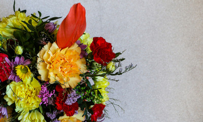 Bright colored spring bouquet on  light background, with  place for text.