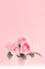Romance celebration flowers background - pink luxury roses bouquet on white wood board, copy space.