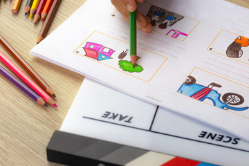 Storyboard drawing with pencil creative sketch cartoon. Storyboarding is process image displayed in sequence for purpose of pre-visualizing motion picture, interactive media. Concept sketching ideas.